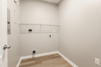 an empty closet in a room with wood floors and white walls at Alexandria of Carmel Apartments, Carmel, IN